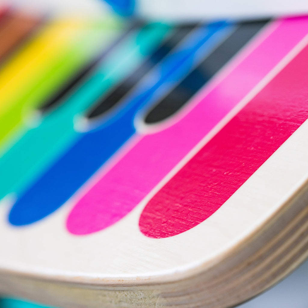 Close-up of colorful piano keys on wooden music toy