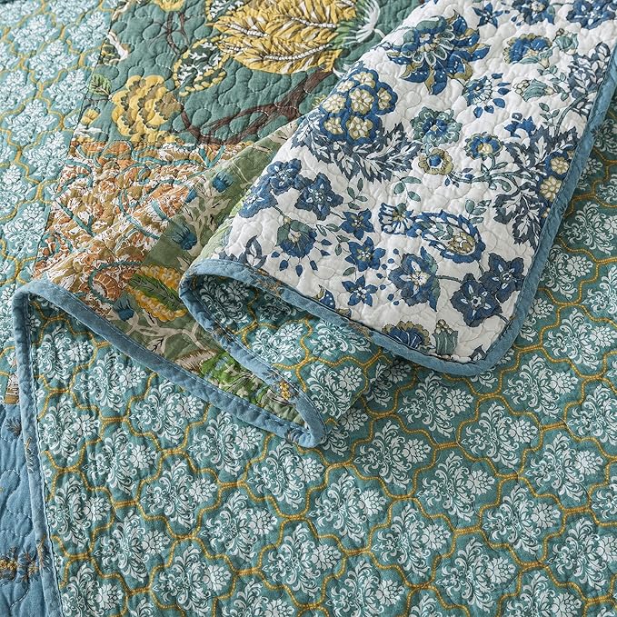 Blue and cream floral pillow topper with matching quilt layers in green and gold
