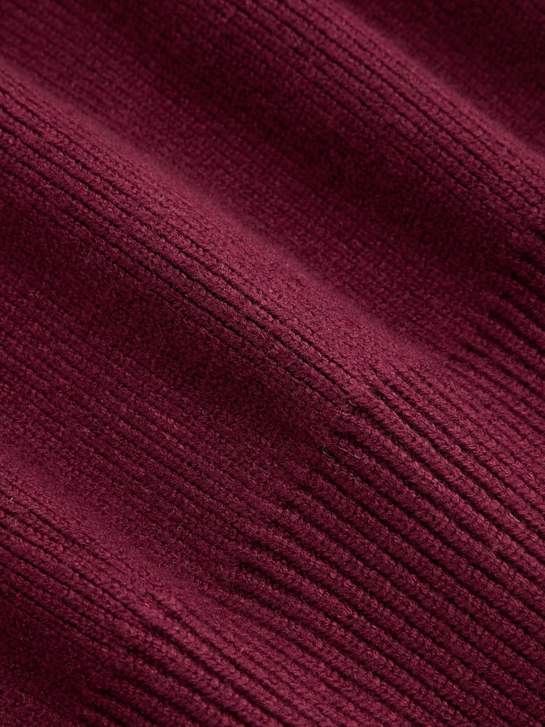 Wine red knitted cardigan fabric texture close-up with fine ribbed pattern