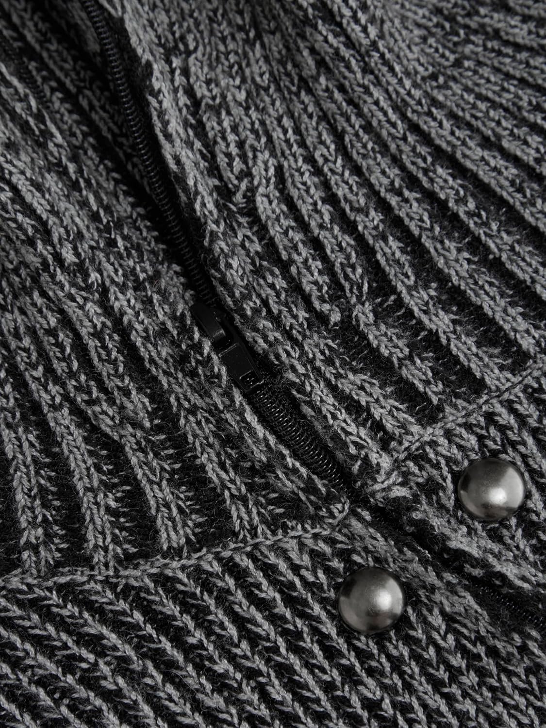 Close-up of grey speckled knit fabric with diagonal rib texture