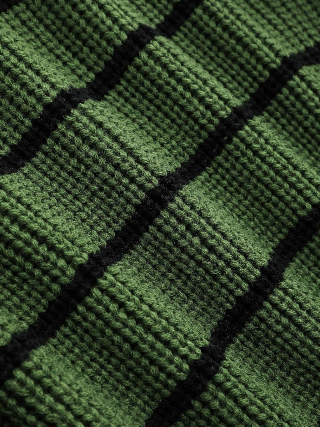Green sweater knit with black horizontal stripe bands and ribbed texture