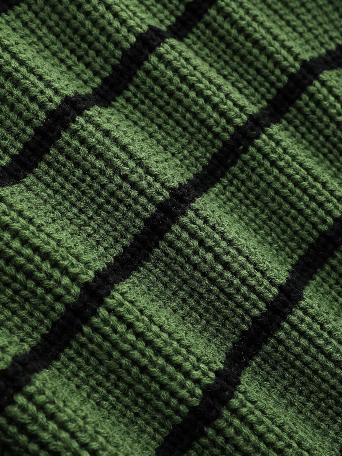 Green sweater knit with black horizontal stripe bands and ribbed texture