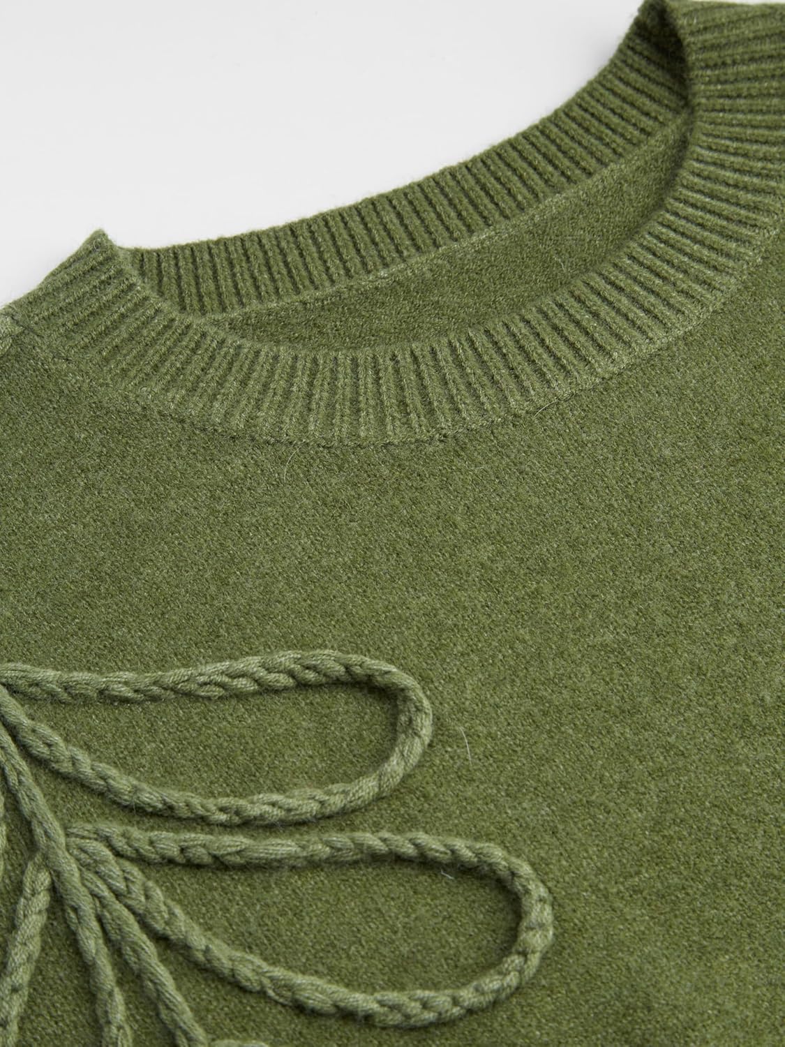 Close-up of olive green knit sweater collar and looped leaf embroidery detail