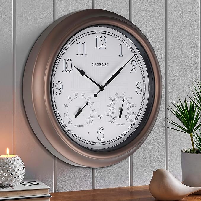 Bronze atomic analog wall clock with white dial, thermometer scale, and humidity gauge
