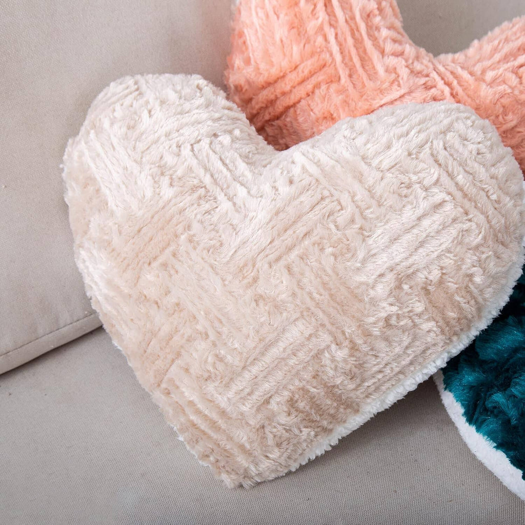 Champagne beige heart-shaped plush throw pillow with fuzzy sherpa texture
