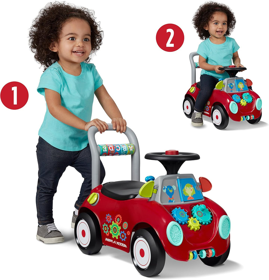 Red kids ride-on car with activity panel, steering wheel, and sit-to-stand seat