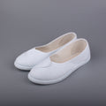 White slip-on casual sneakers with padded heel and textured stitching