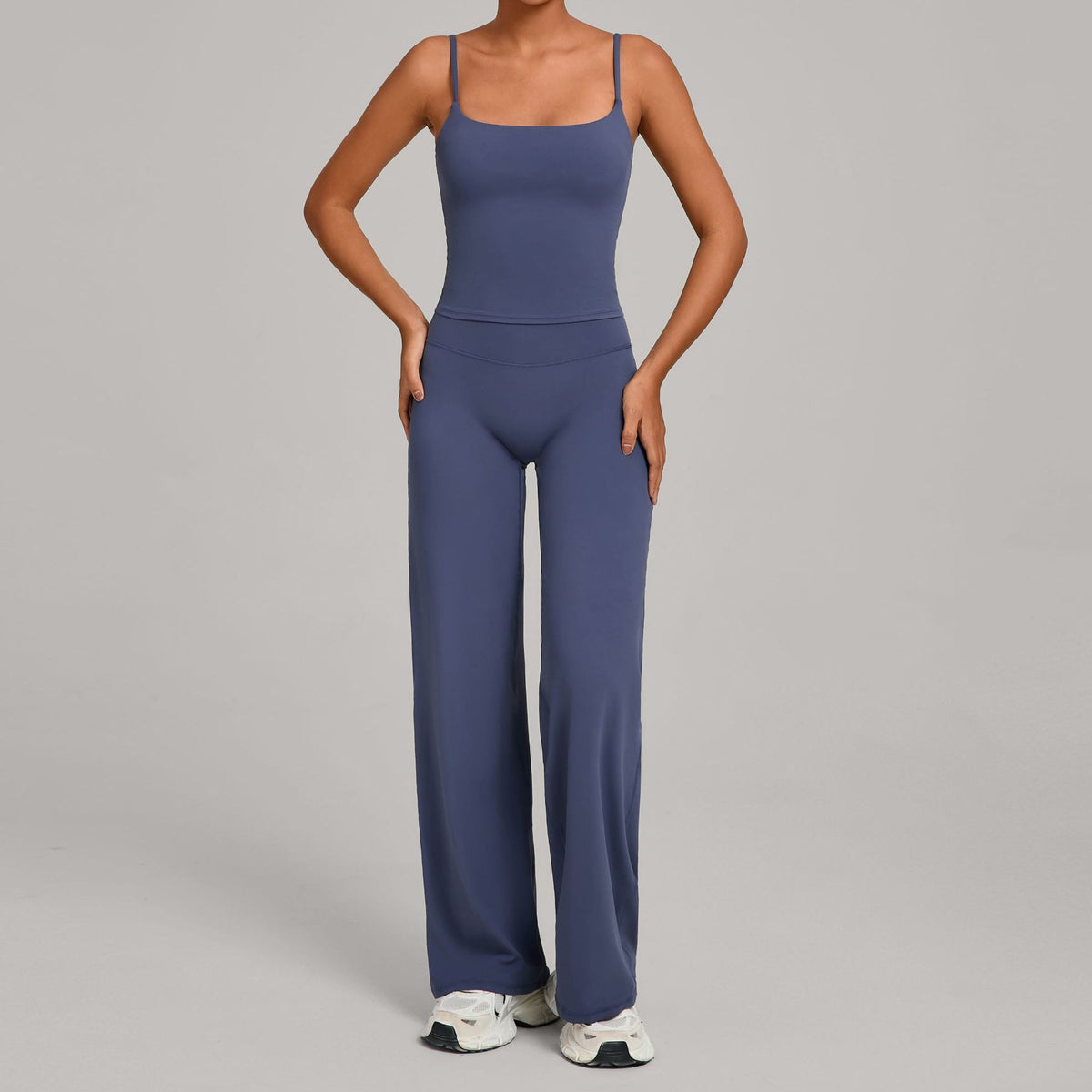 Women's yoga suit in deep blue, spaghetti-strap crop top and wide-leg pants