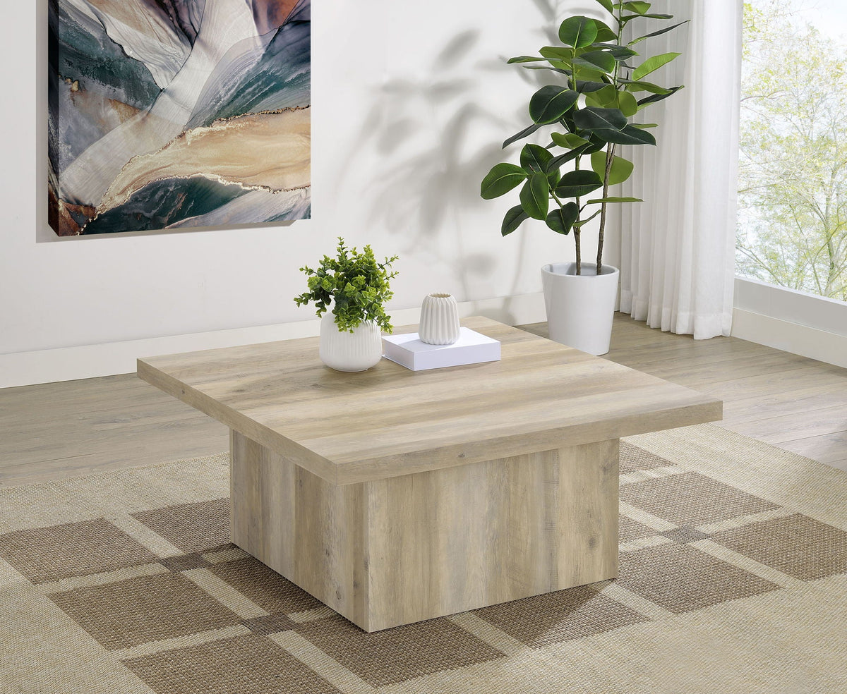 Distressed pine square coffee table with straight legs and textured wood top