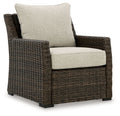 Brown woven lounge chair with beige seat and back cushion