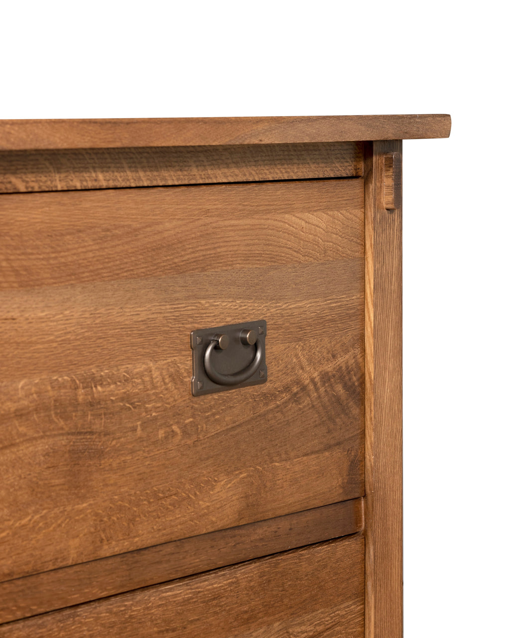 Close-up of drawer front with metal pull on walnut-stain file cabinet