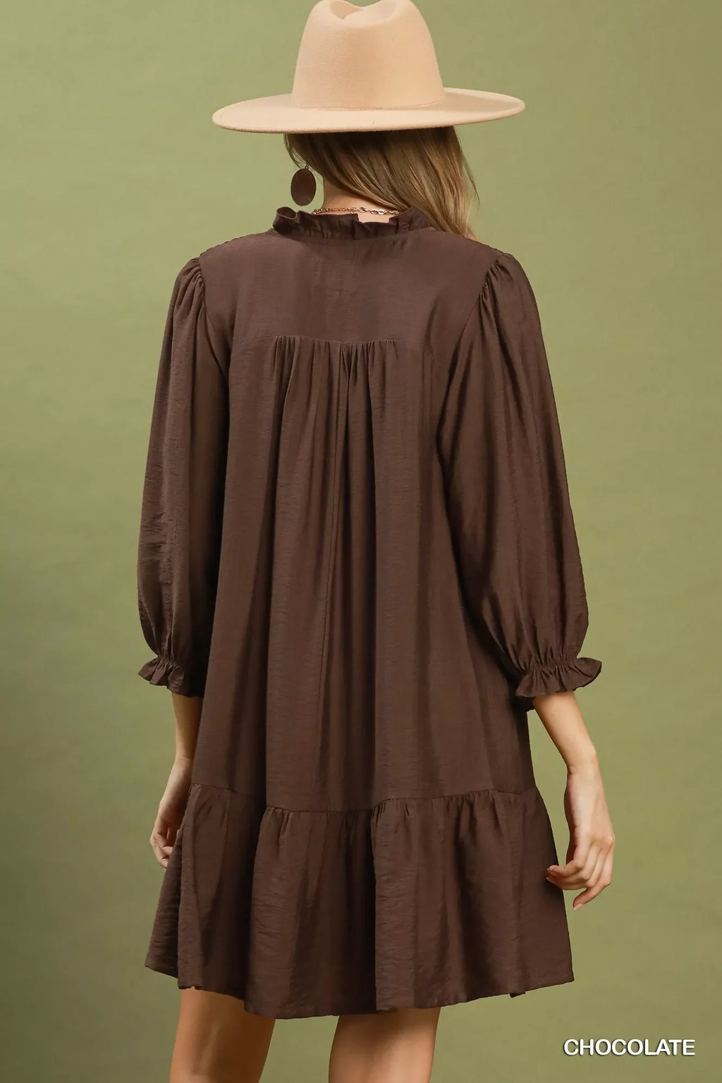 Chocolate-brown tiered mini dress with long sleeves and a gathered back yoke.