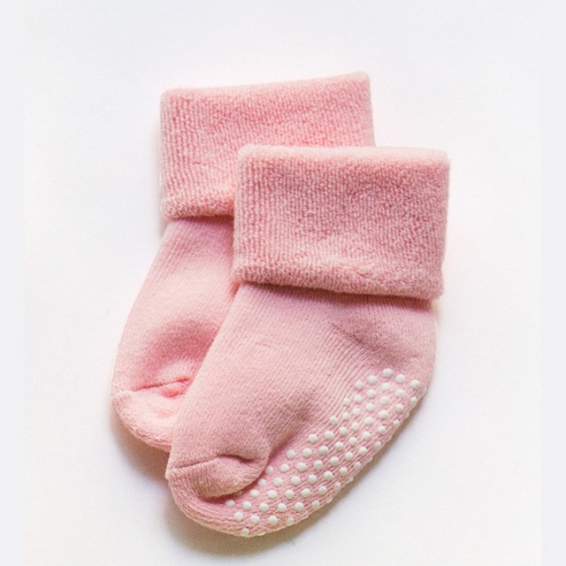 Pink children non-slip socks with dotted grip soles, stacked pair