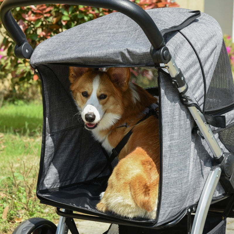 Corgi peeking from a gray pet stroller with mesh sides and open front canopy.