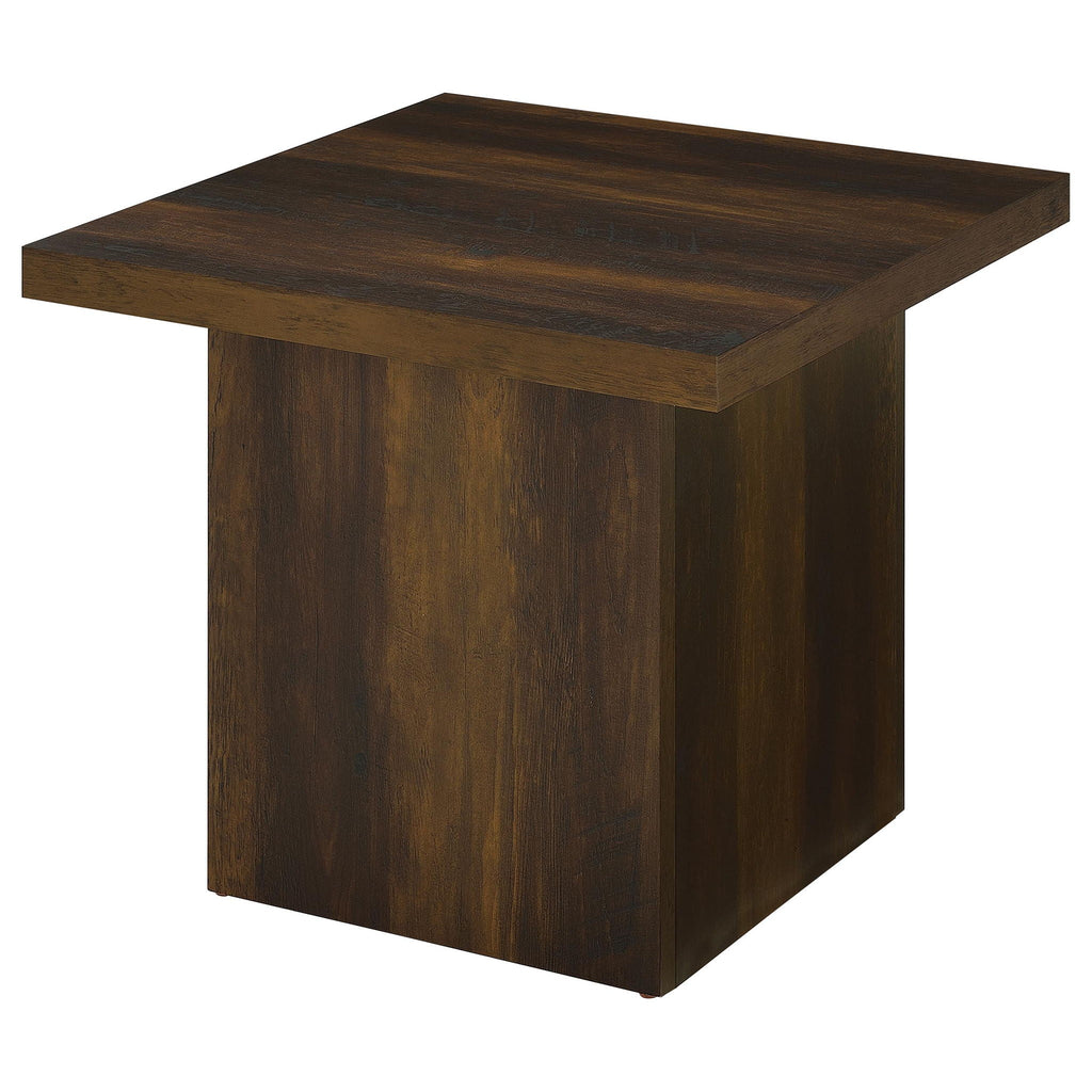 Square coffee table in dark pine woodgrain, angled view of top and paneled legs.