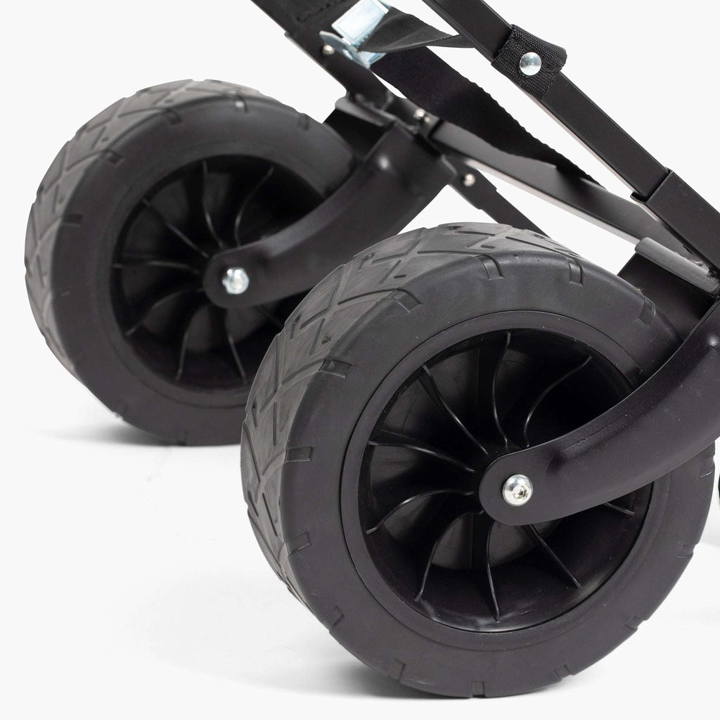 Lawn roller wheel and axle close-up with black frame