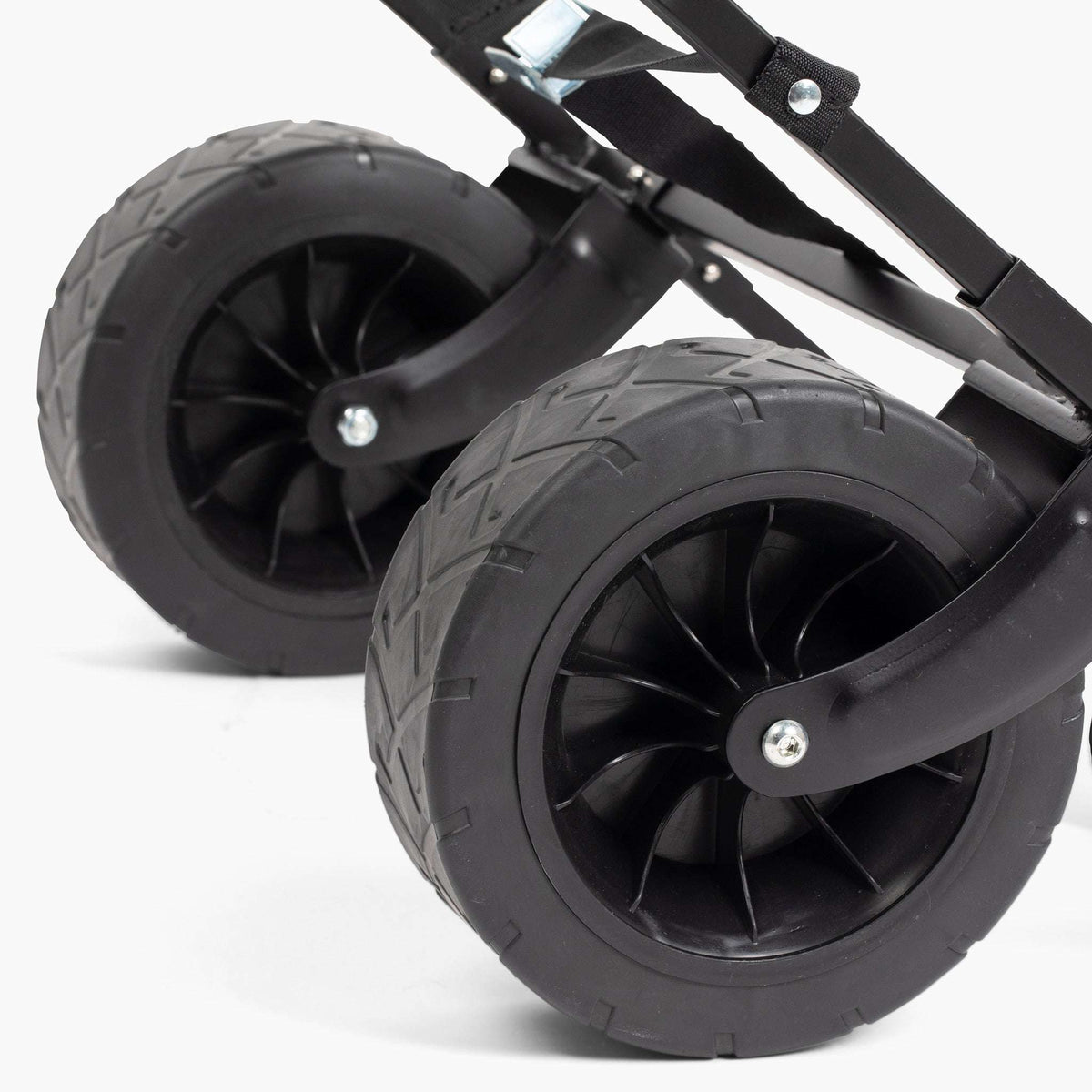 Lawn roller wheel and axle close-up with black frame