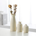 Beige ceramic vase decoration set of 3 with matte finish, one holding dried flowers