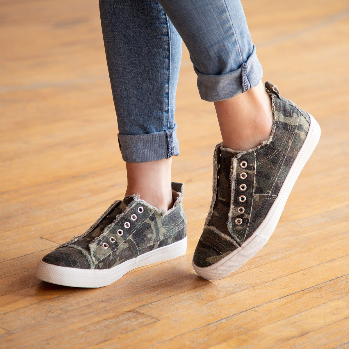 Gray camo plaid slip-on canvas sneakers with grommet eyelets and white sole