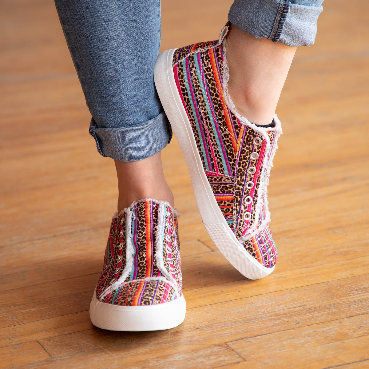 Multicolor patterned slip-on canvas sneakers with eyelet laces and white rubber sole