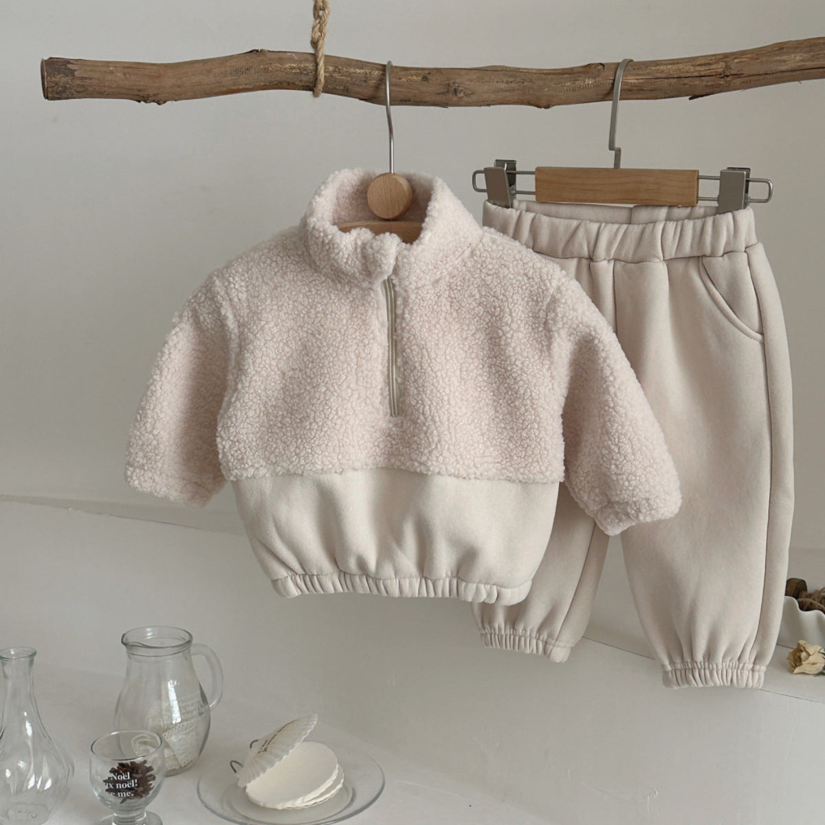Fuzzy light beige half-zip sweater with stand-up collar, hanging front view