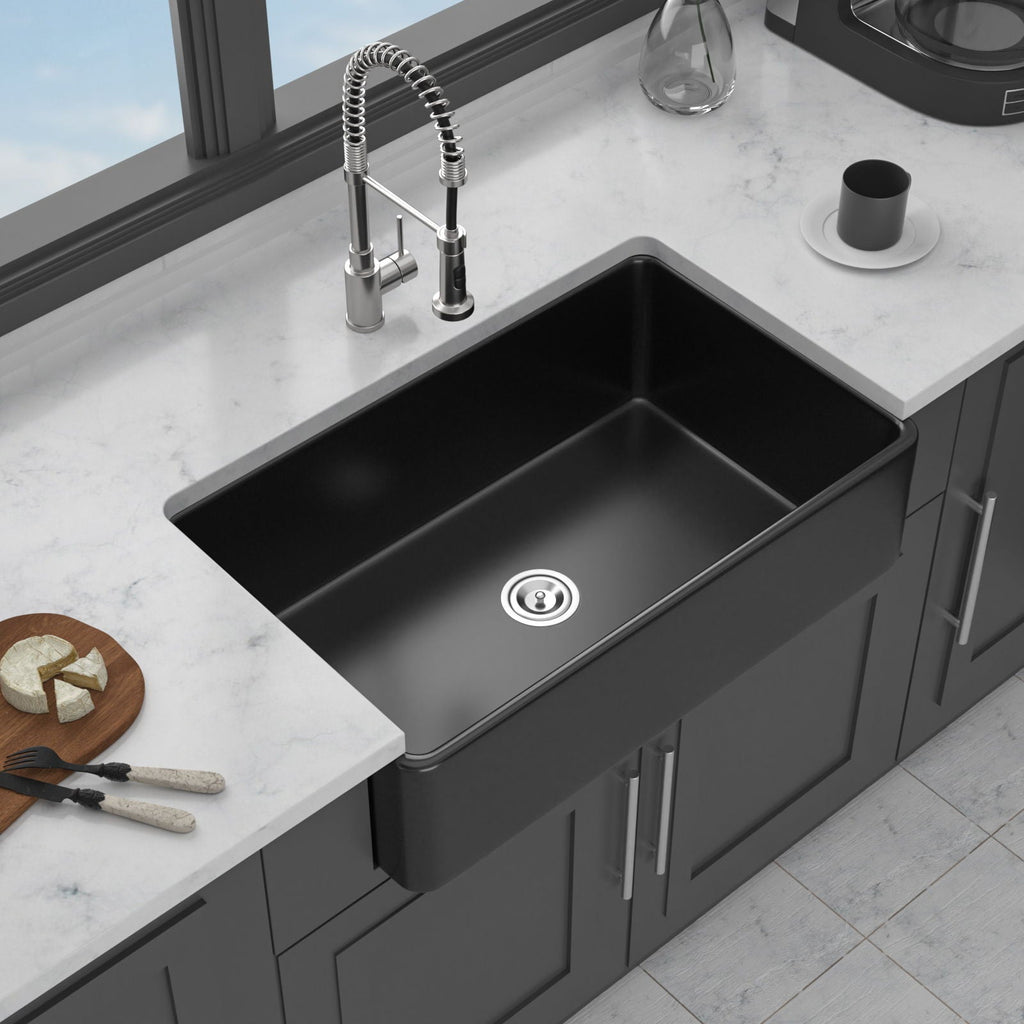 Black farmhouse apron-front single-bowl ceramic sink with center drain and deep basin
