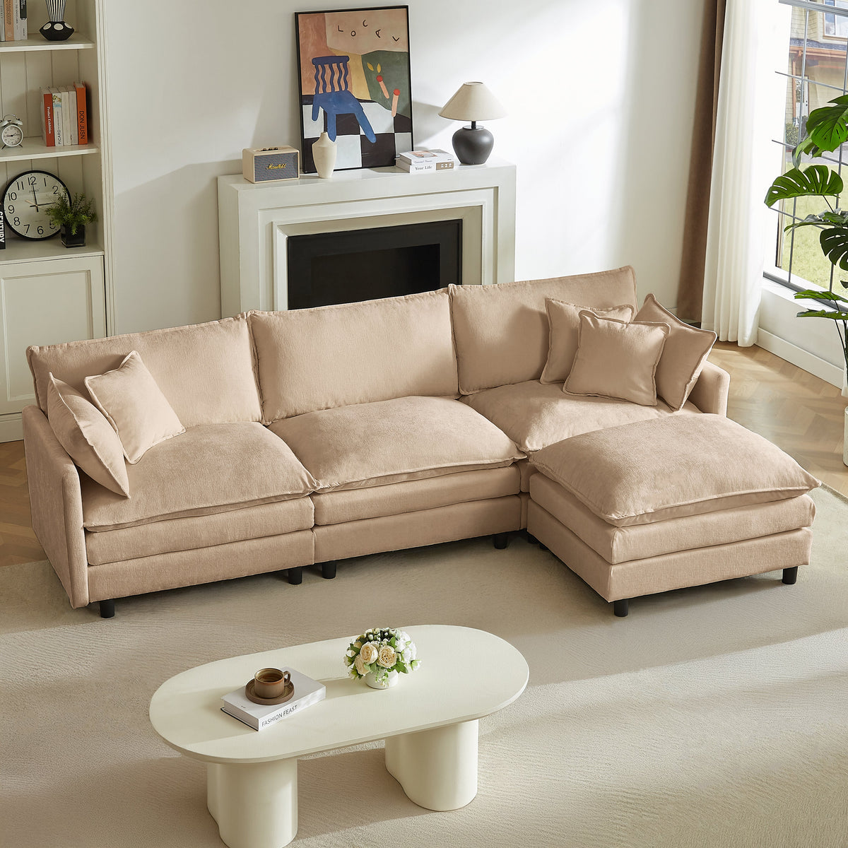 Beige modular sectional sofa with chaise and four throw pillows, plush upholstered cushions.