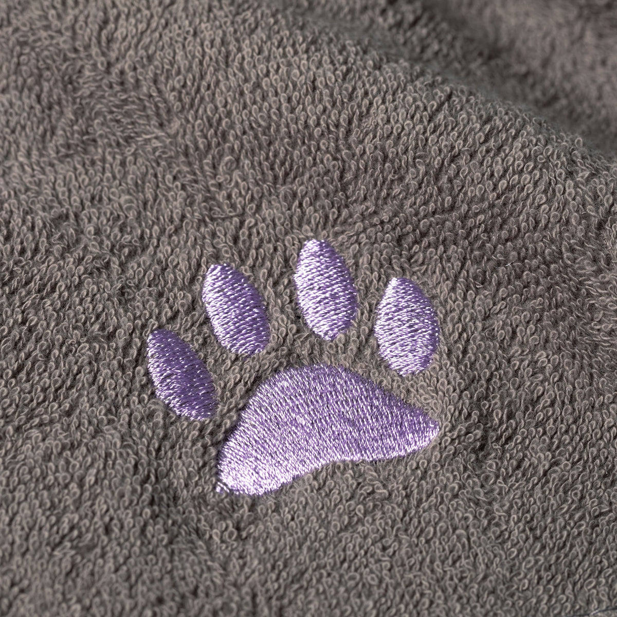 Embroidered paw wash cloth detail, gray terry with purple stitched paw print
