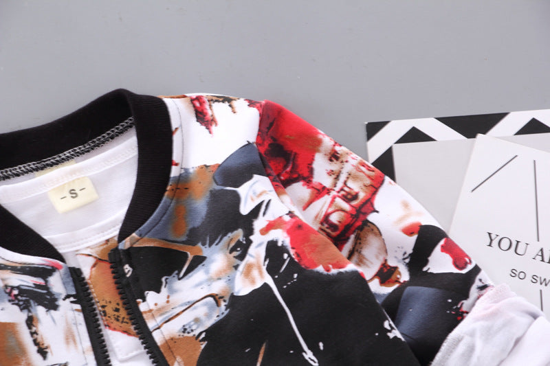 Close-up of abstract print jacket shoulder, sleeve, and black collar
