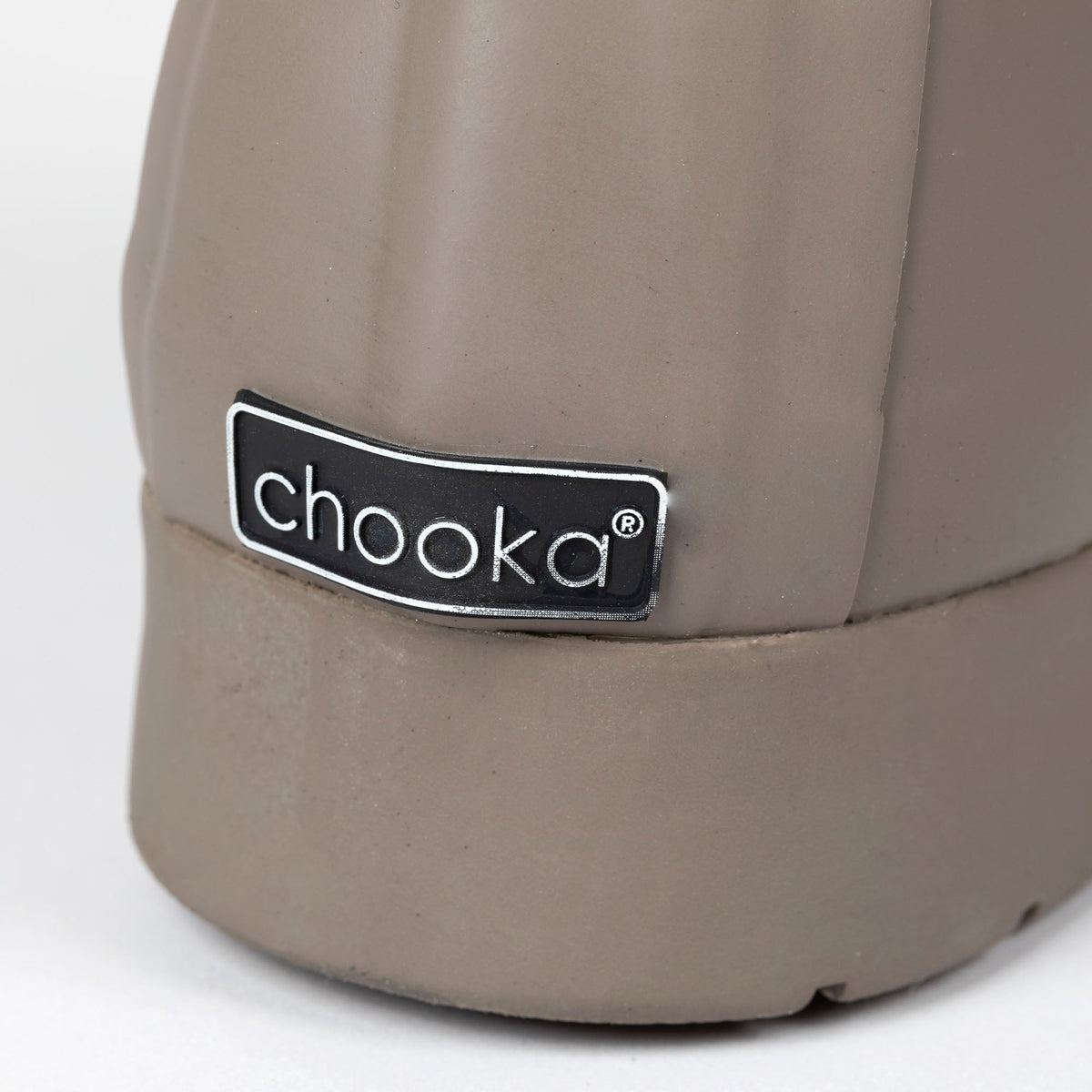 Taupe tall rain boot heel with “Chooka®” logo patch.