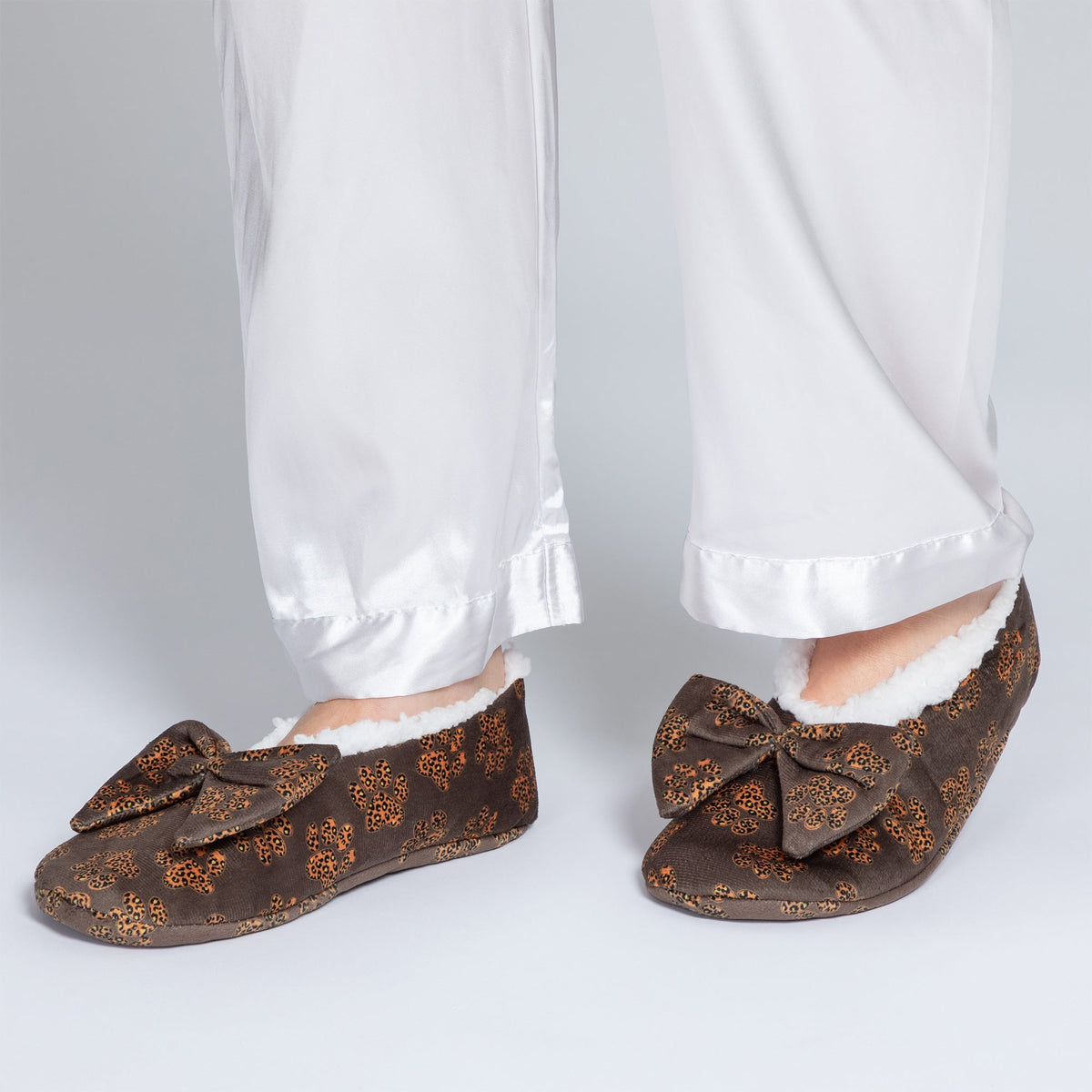 Brown leopard paw slippers with large bow and plush lining, side view
