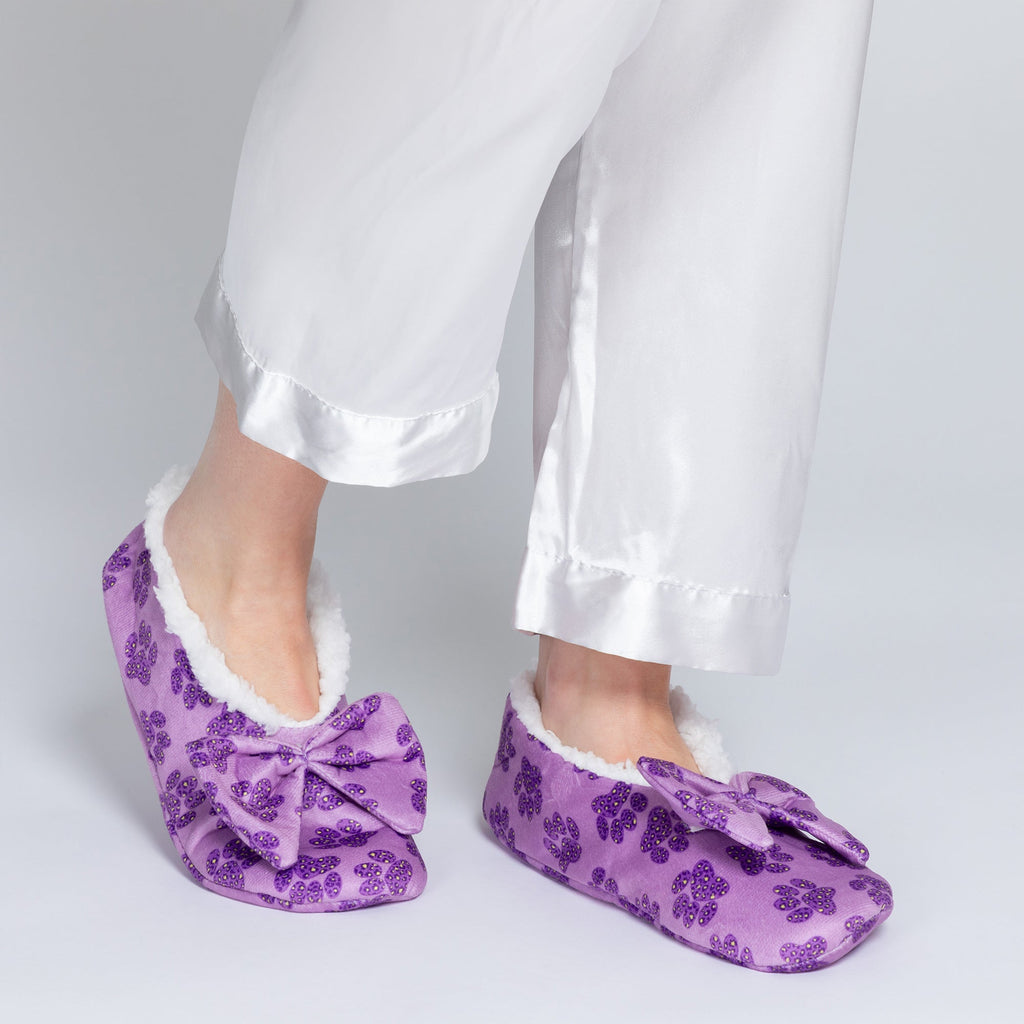 Purple sequin paw slippers with plush white lining and large bow detail