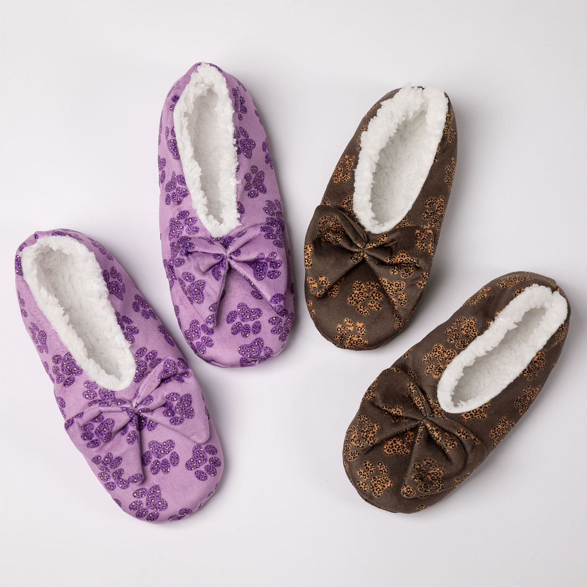 Pair of leopard-print paw slippers with large bow, plush white lining, purple and brown