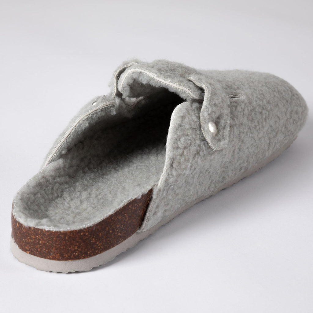 Gray plush sherpa clog slipper with open top lining and brown sole trim