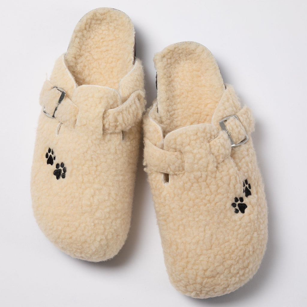 Cream sherpa clog slippers with paw-print appliques and adjustable buckle strap
