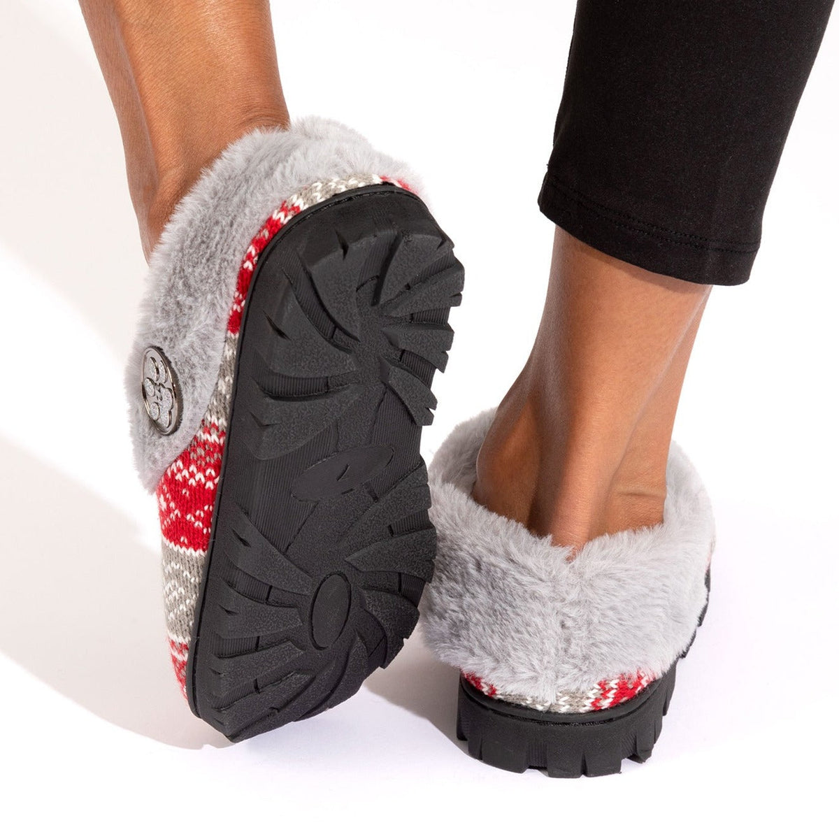 Pair of knit paw clog slippers with plush gray lining and black tread outsole