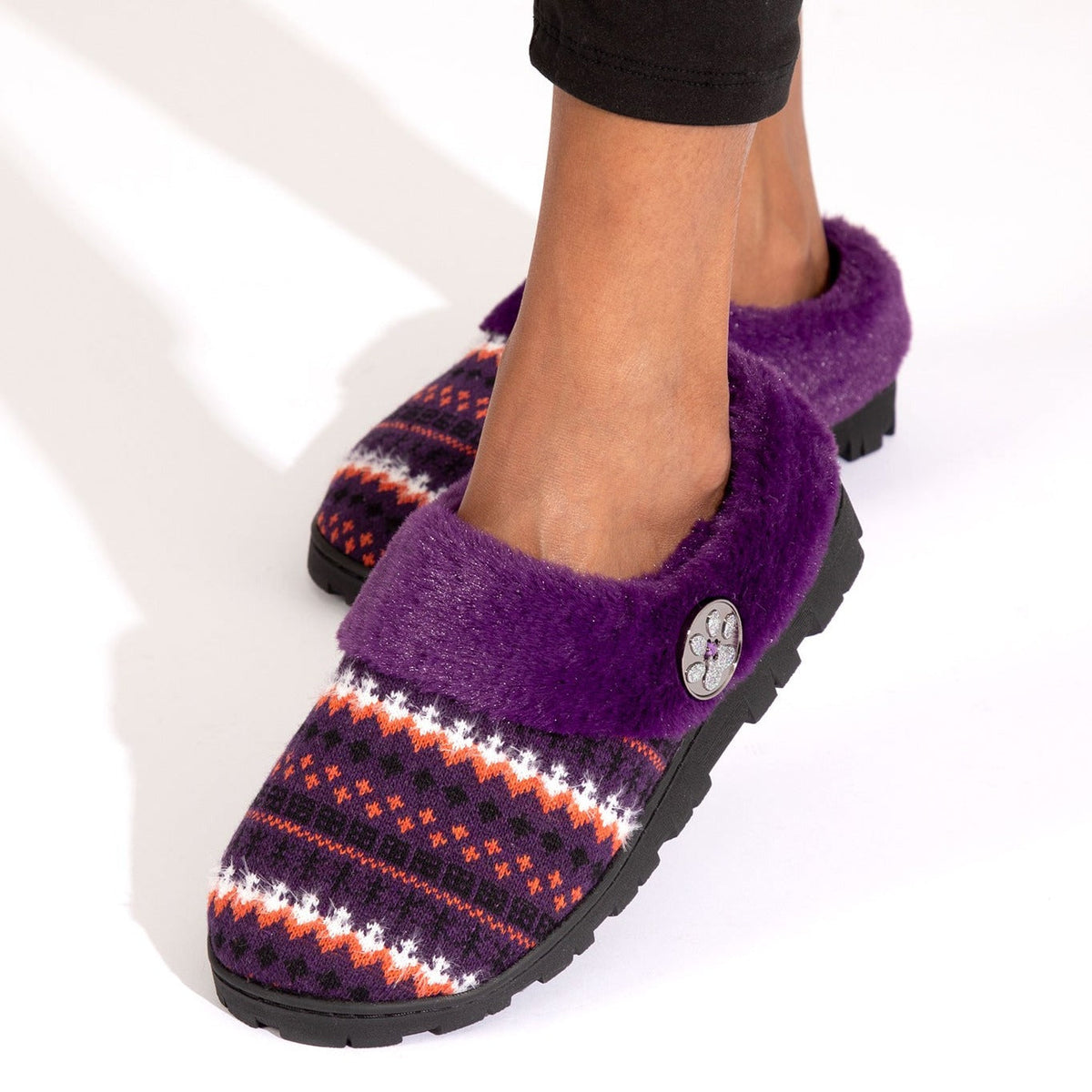 Purple knit clog slippers with multicolor pattern and round paw charm button