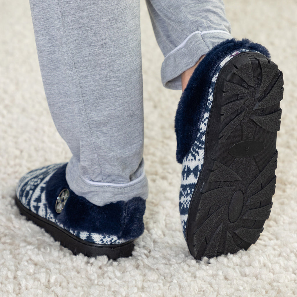 Blue fair isle knit clog slippers with dark rubber sole and paw charm button