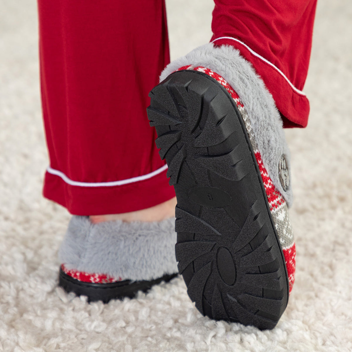 Gray-fur lined knit clog slipper with red-and-gray fair isle pattern and tread sole