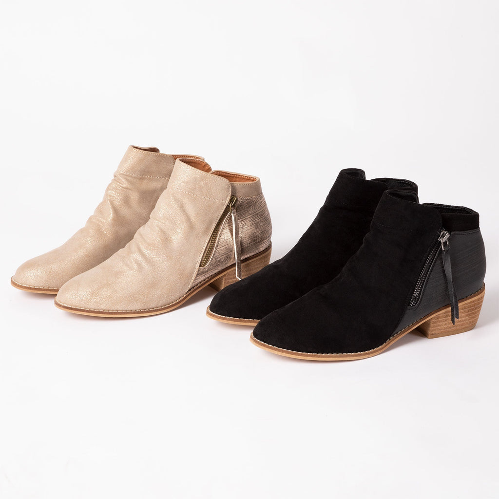 Tan and black side-zip ankle boots, suede-like finish and low block heels.