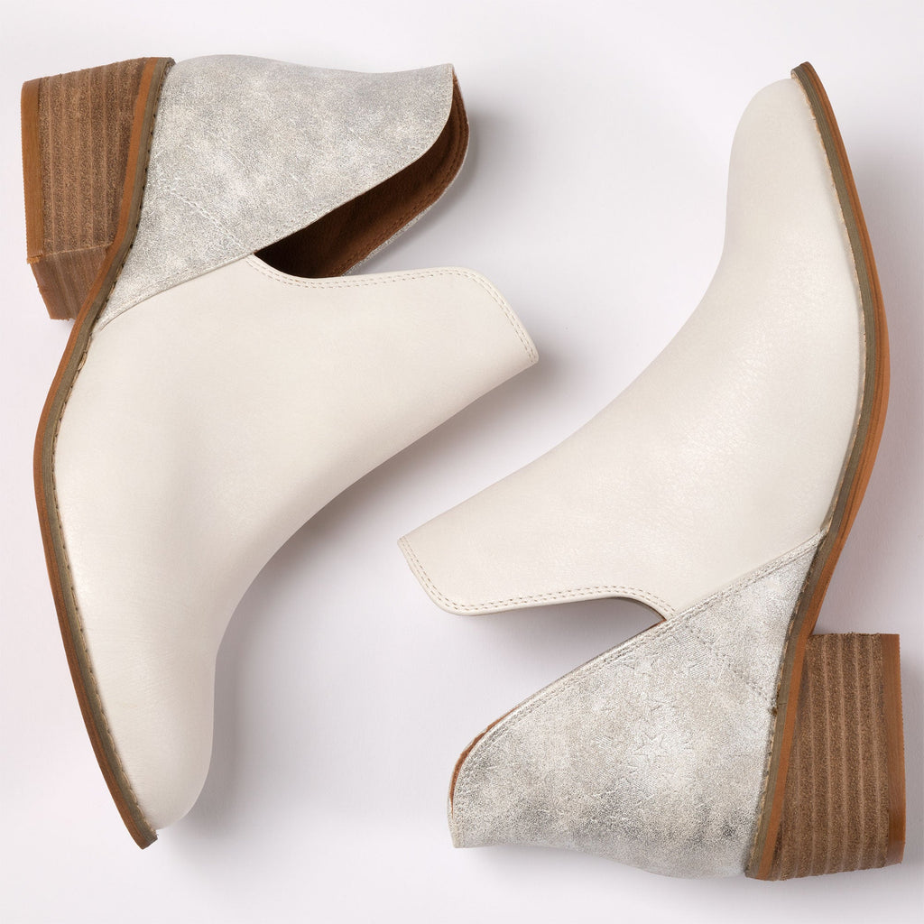 White slip-on ankle boots with speckled finish and tan low block heel