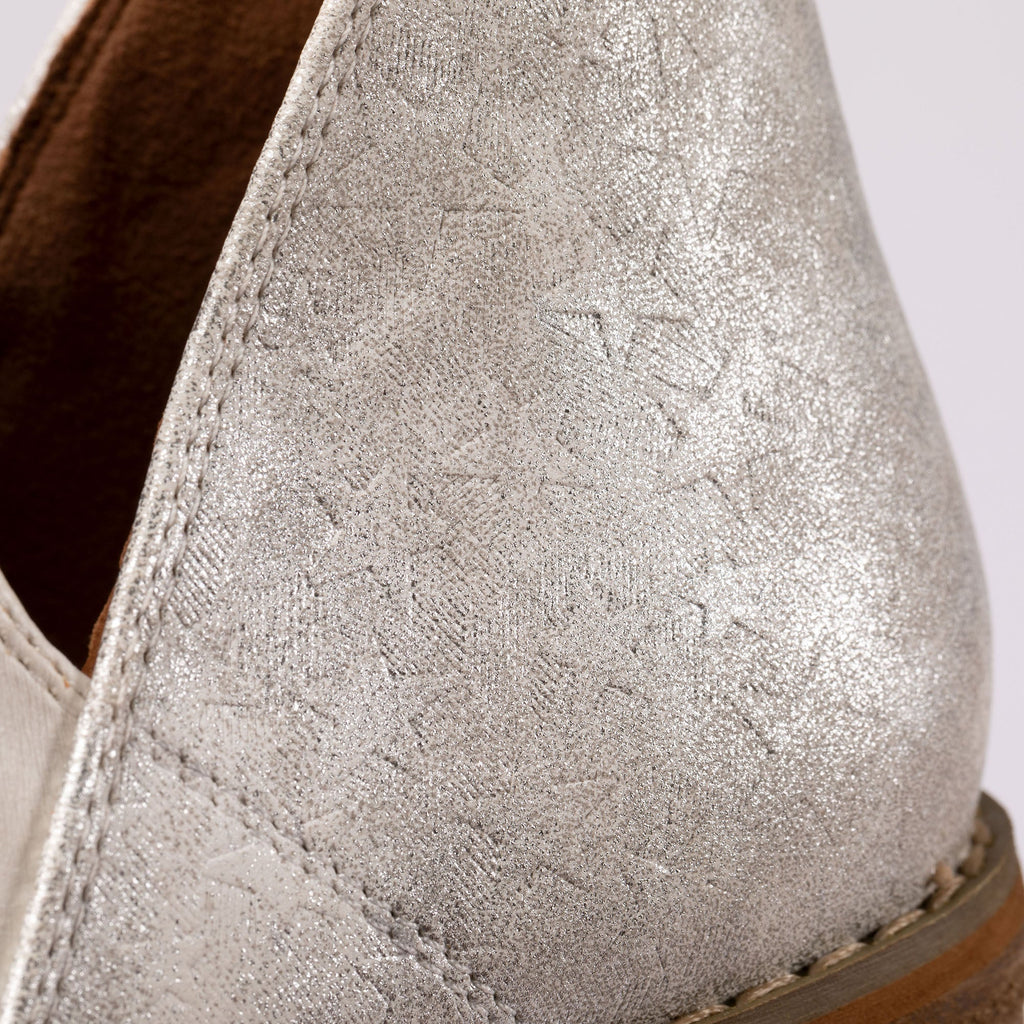 White ankle boot upper with speckled textured finish and visible seam stitching