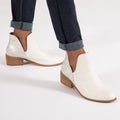 White slip-on ankle boots with low block heel and side elastic gore