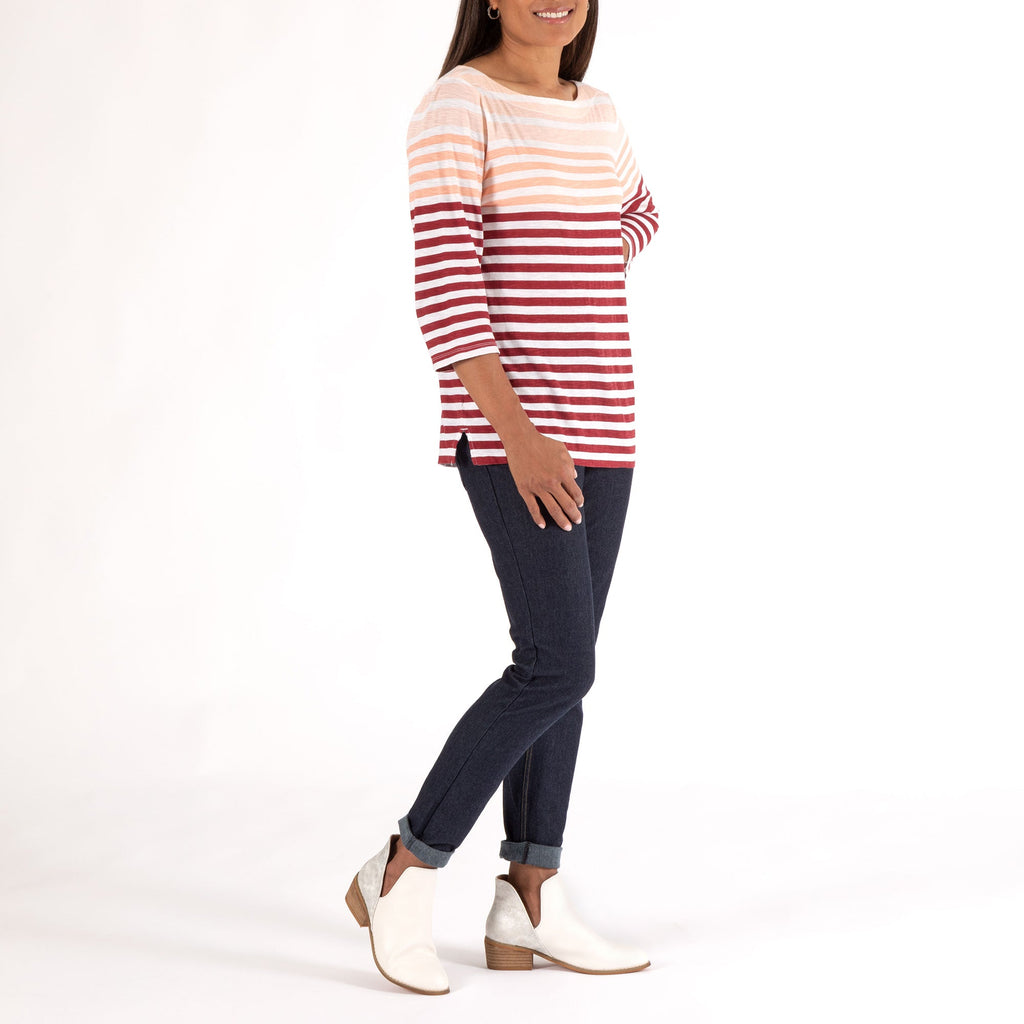 White slip-on ankle boots with low block heel, shown on model with jeans