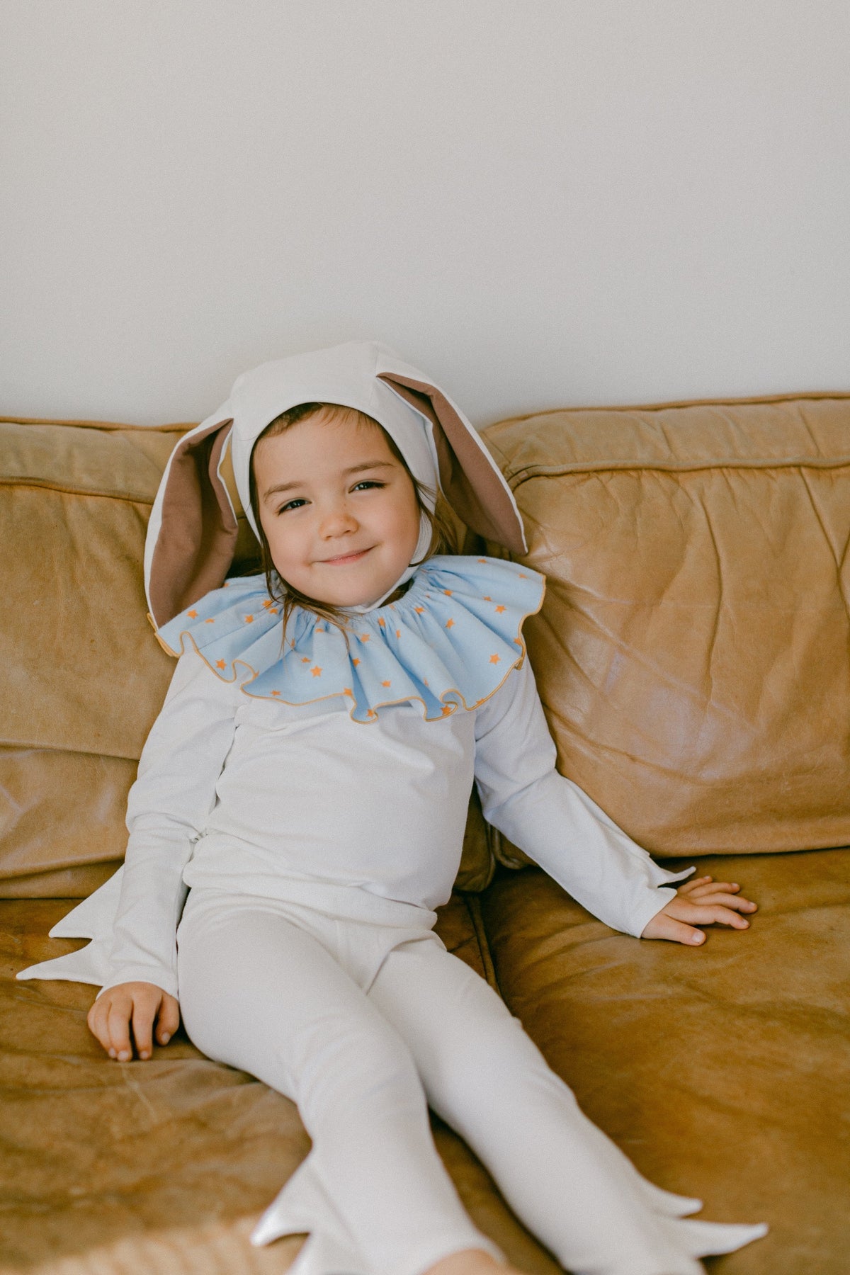 Baby bunny costume romper with blue star bib and long-ear hood