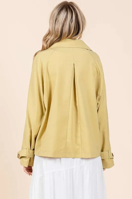 Yellow trench coat jacket back view with double-breasted button detail