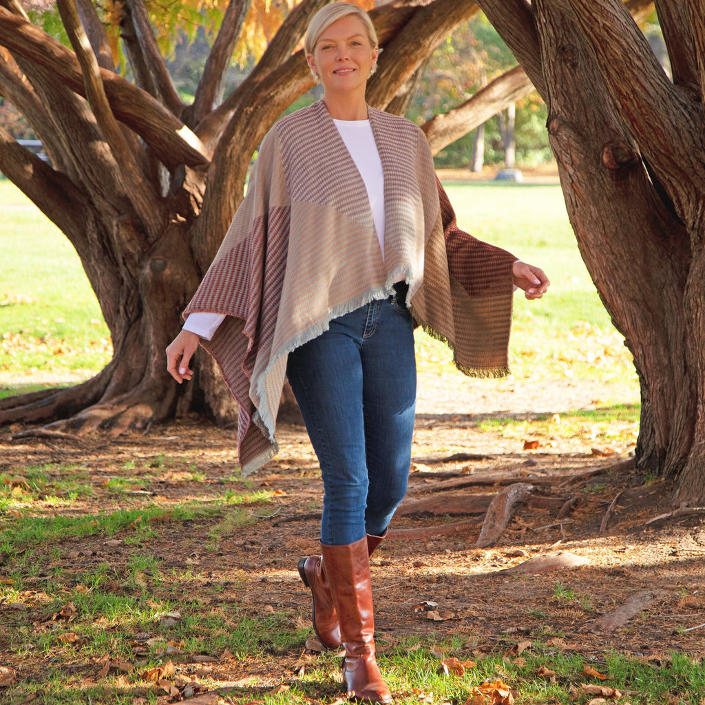 Striped khaki and red poncho with draped sleeves and fringe hem