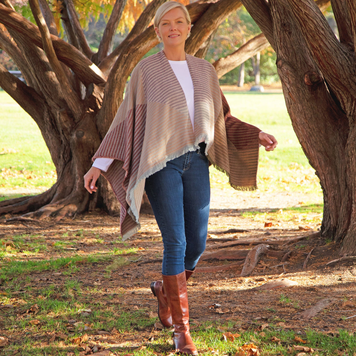 Striped khaki and red poncho with draped sleeves and fringe hem