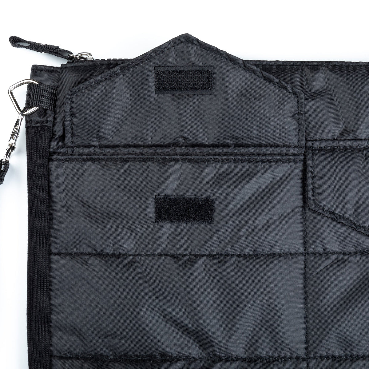 Black quilted tablet case close-up of interior panel and fabric label