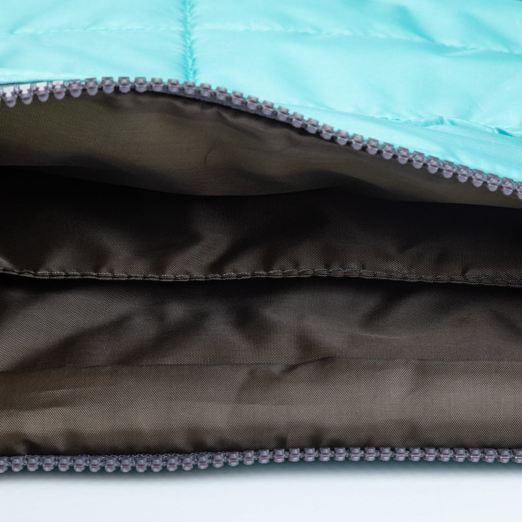 Blue puffer tablet case interior with gray lining and zipper track